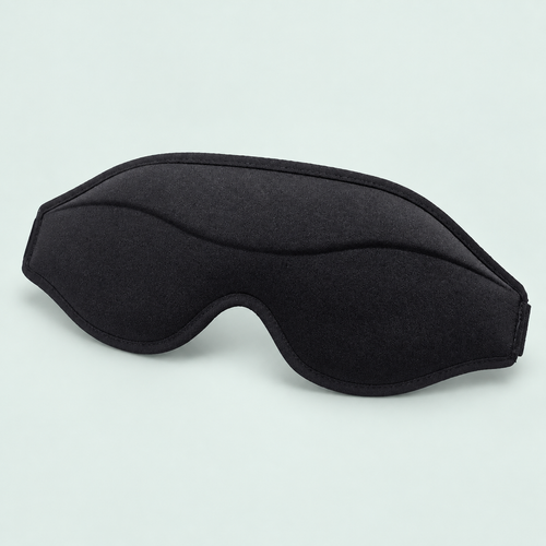 Contoured memory-foam eye mask — representative option in a coastal studio setting; choose options for exact contents.