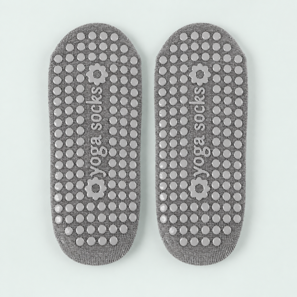 Cross-strap Pilates socks — representative option in a coastal studio setting; choose options for exact contents.