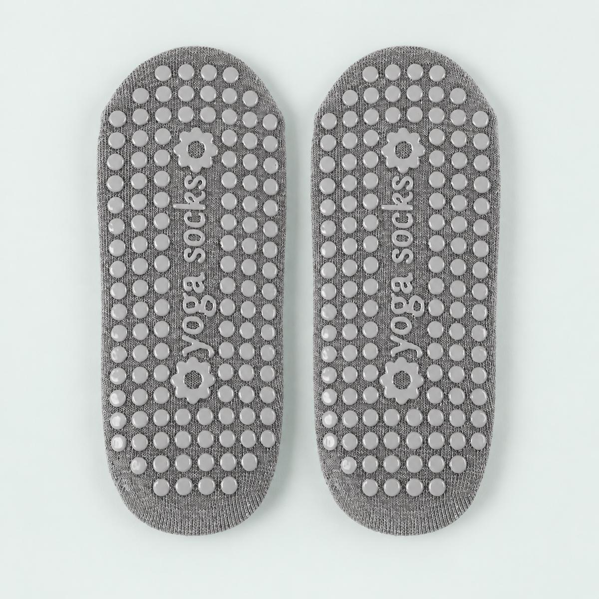 Cross-strap Pilates socks — representative option in a coastal studio setting; choose options for exact contents.