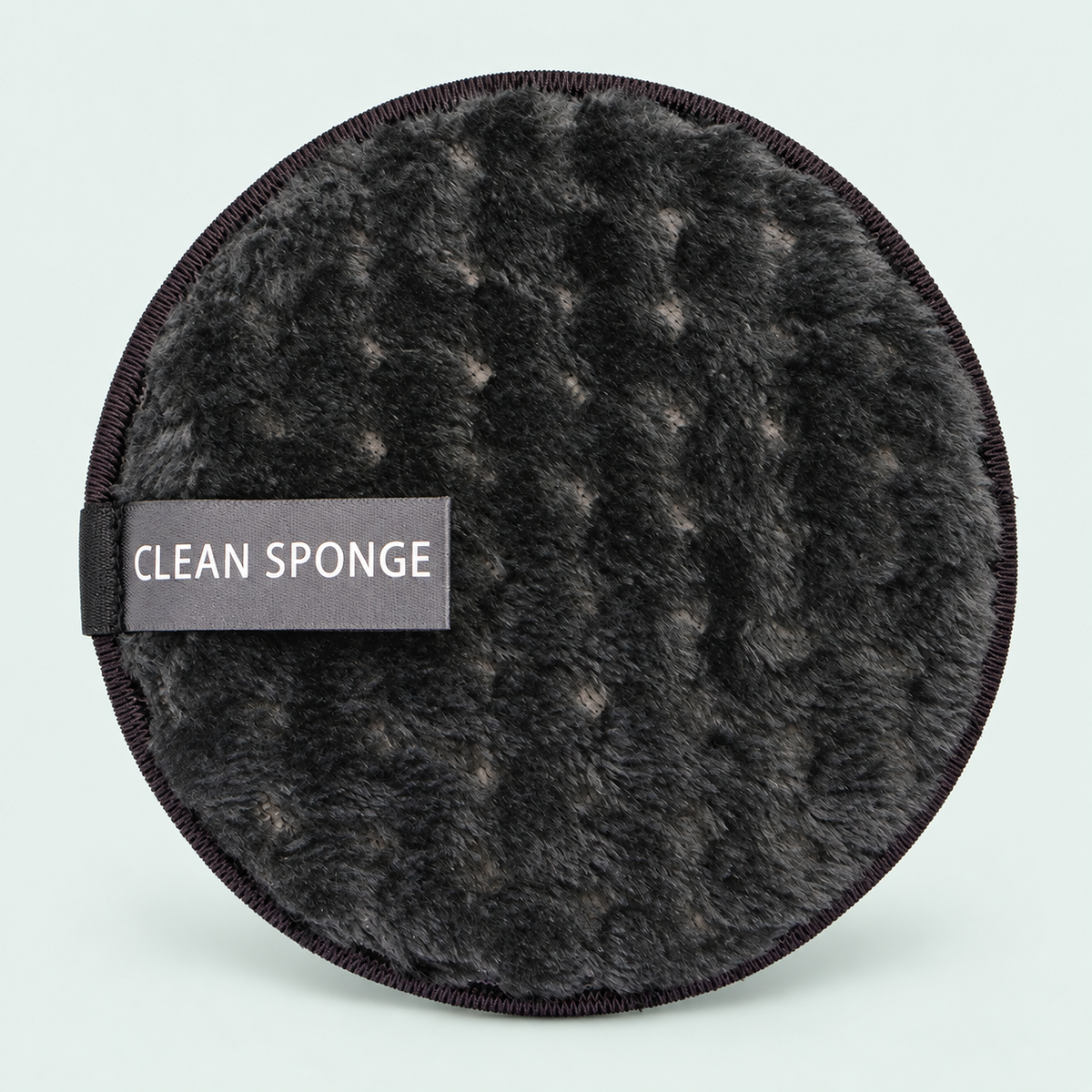Reusable cleansing puff — representative option in a coastal studio setting; choose options for exact contents.